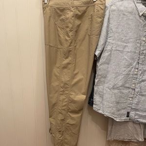 The North Face EUC performance wear. button-up hem feature for hiking & biking.